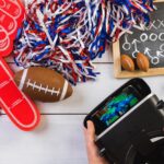 Stół do gry w piłkę nożną. Oglądanie gry na goglach VR.